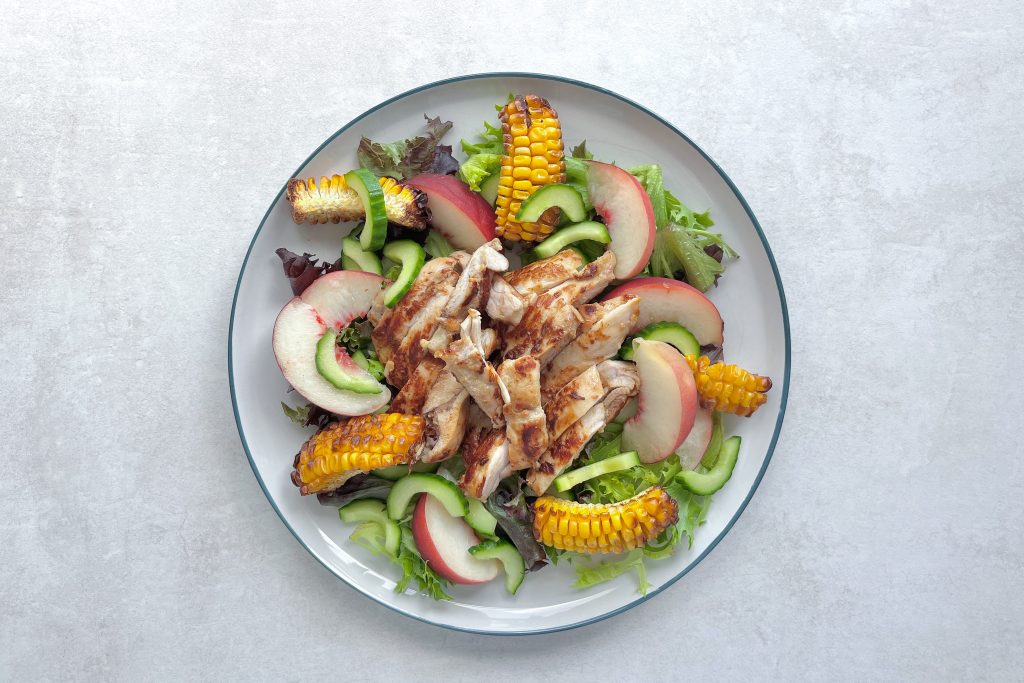 A plate of Miso and Peach Chicken Salad